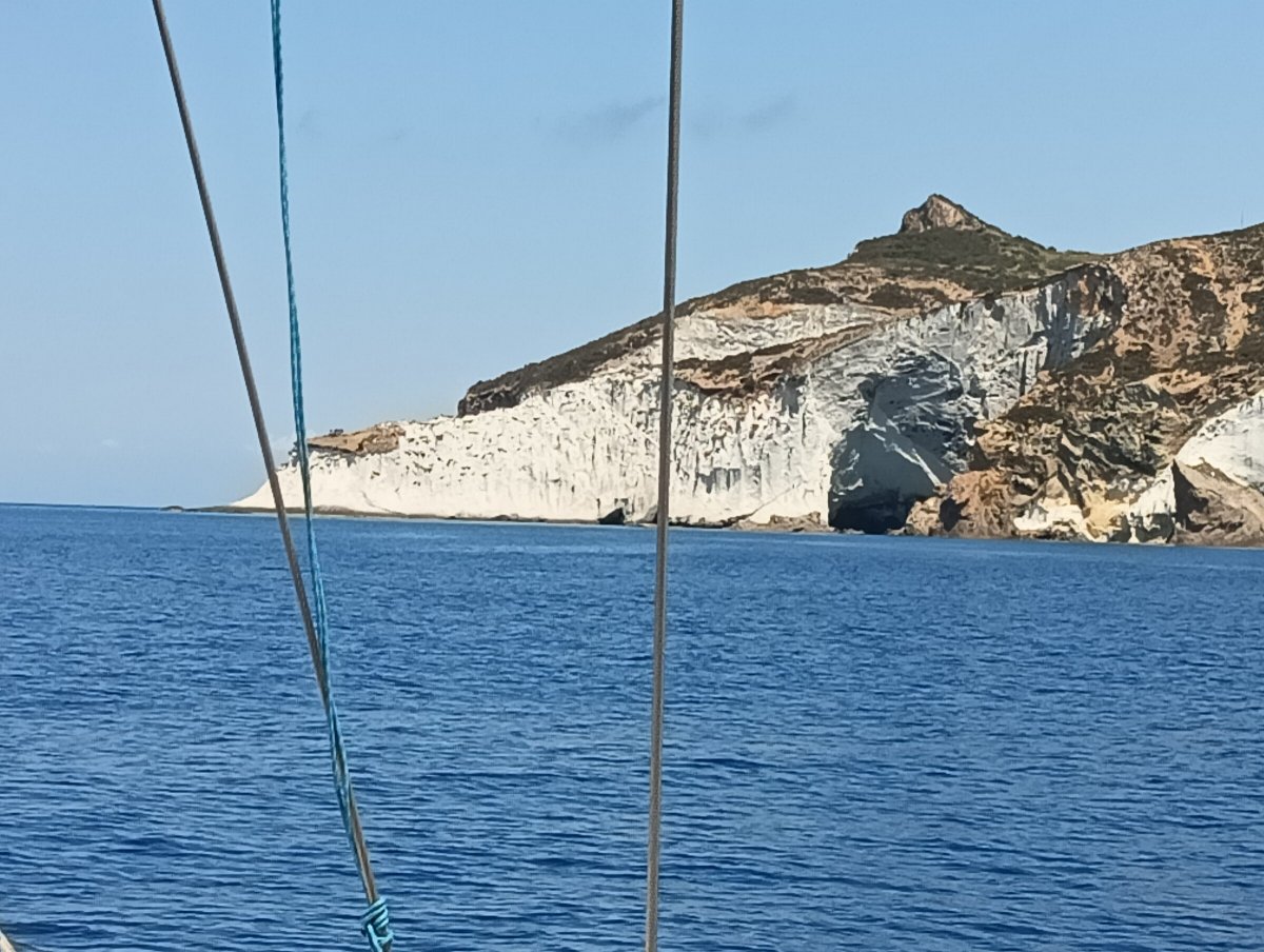 Sailboat in the Mediterranean with mountains in the background