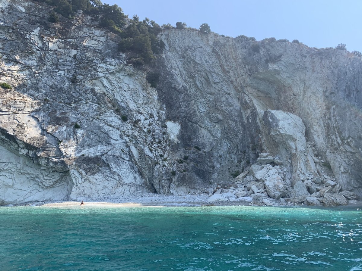 From Corfu to Paxos and Antipaxos