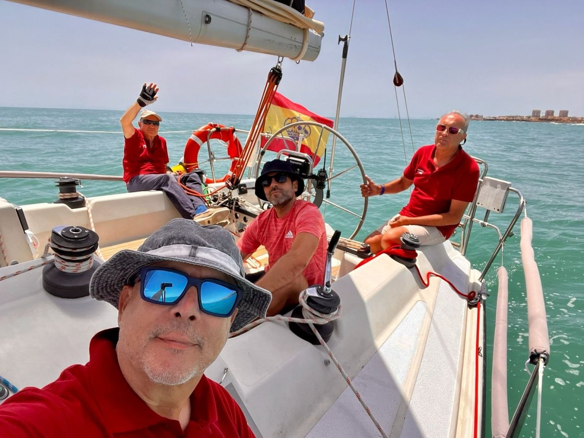 Group of adults learning to sail a sailboat in Alicante