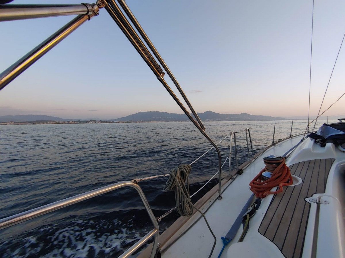 View of Benalmádena from the sea with sunset