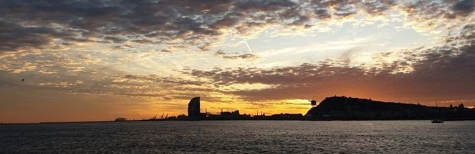 Sailing boat at Barcelona's sunset
