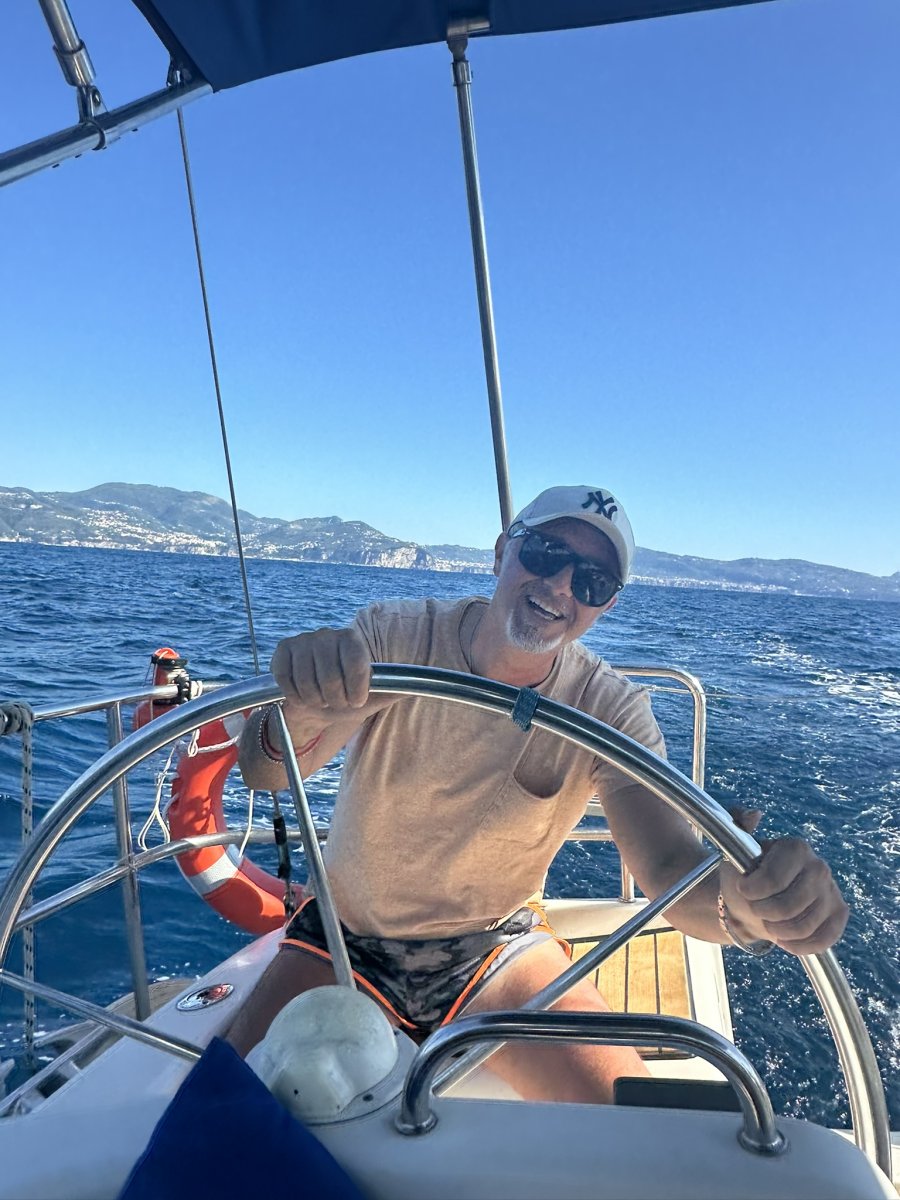 Boat sailing through the sea with views of Capri