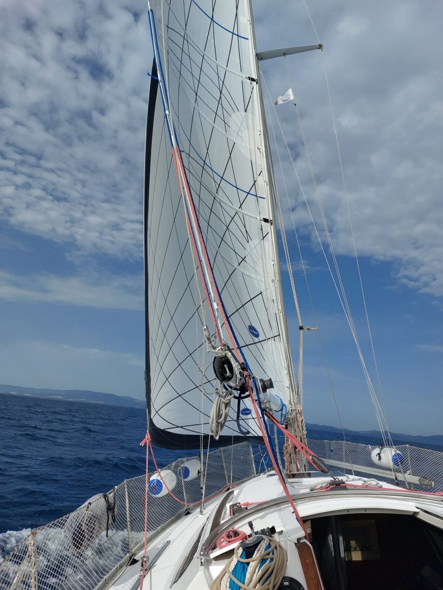 A sailboat in the beautiful blue sea of Elba Island