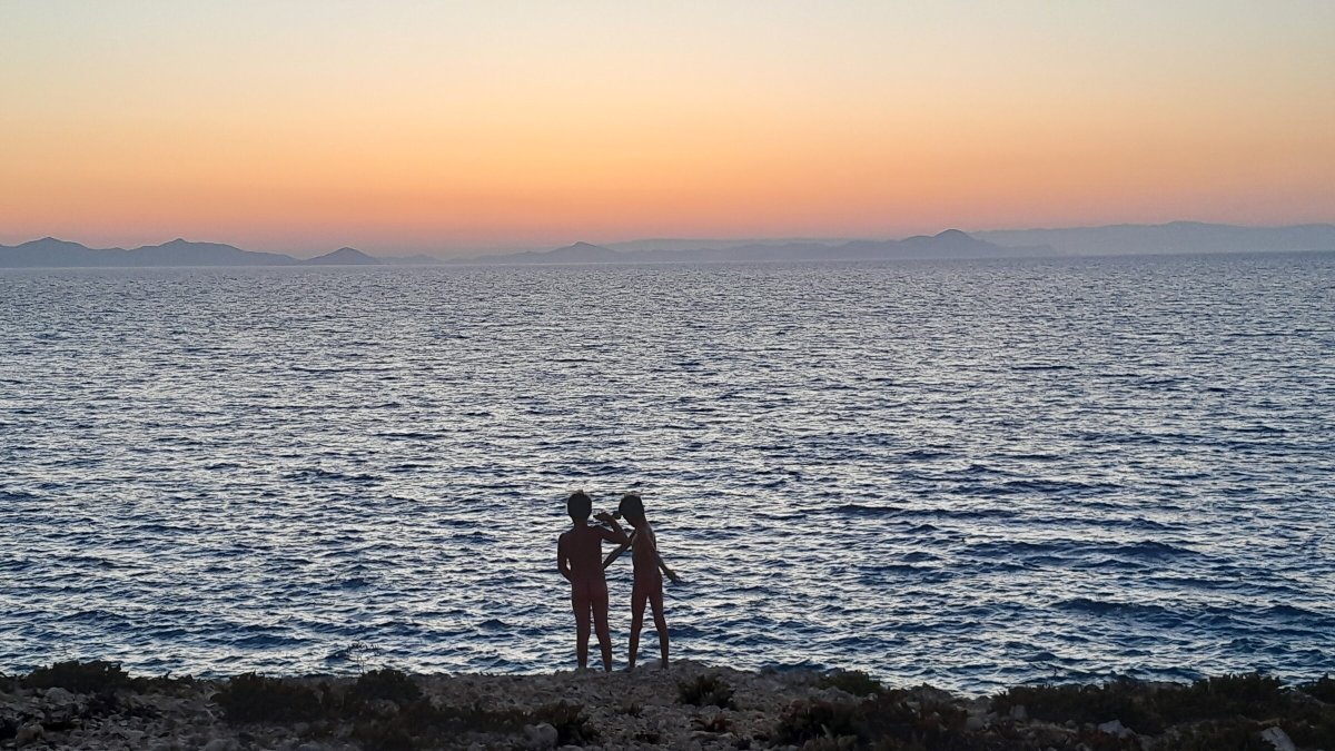 Family sailing under the Greek sun