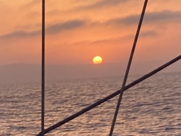 Sunrise on a sailboat in Jávea. Morning meditation and relaxation session
