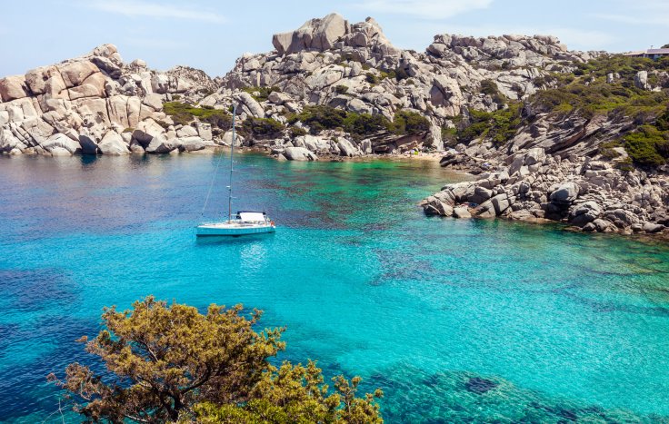 lonely-boat-in-picturesque-bay-in-sardinia-2025-01-09-05-37-41-utc