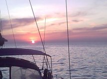 Sailboat in the sea with sunset