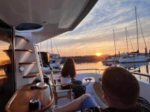 Experience the solar eclipse in Gijón from a classic motorboat