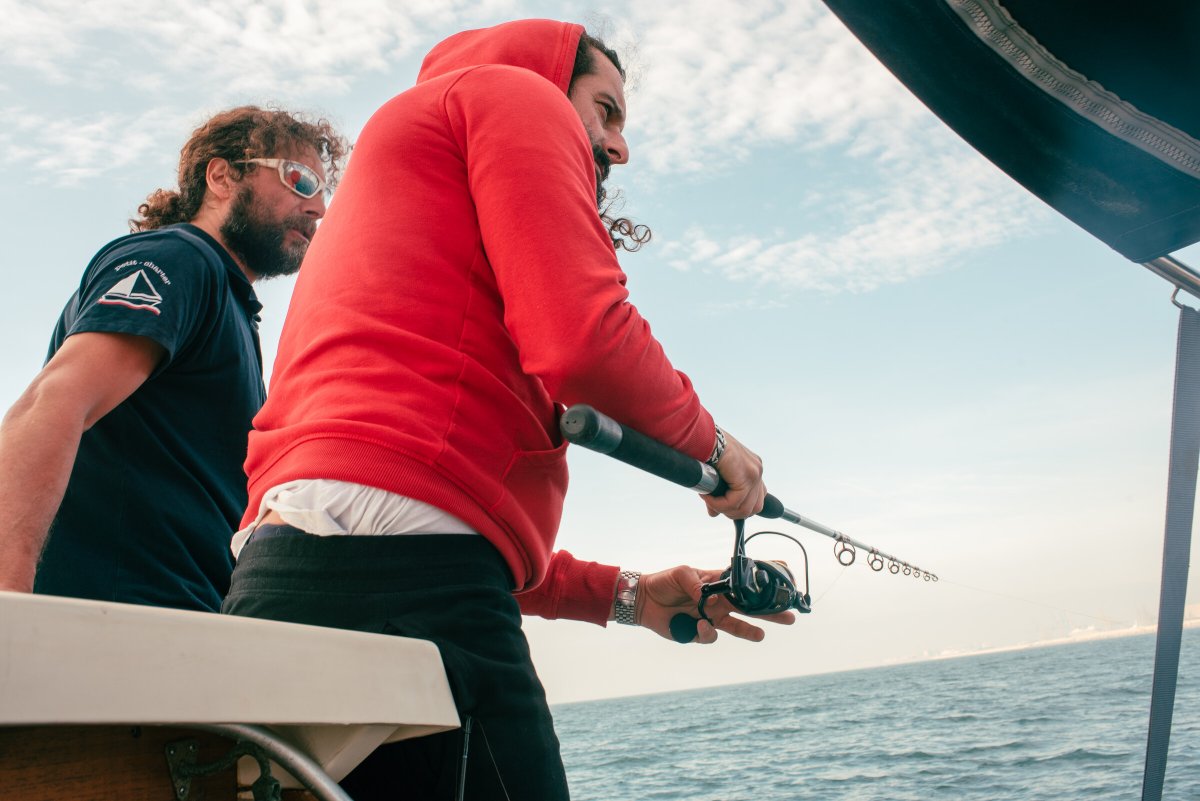 Fishing in sailboat on Barcelona coast