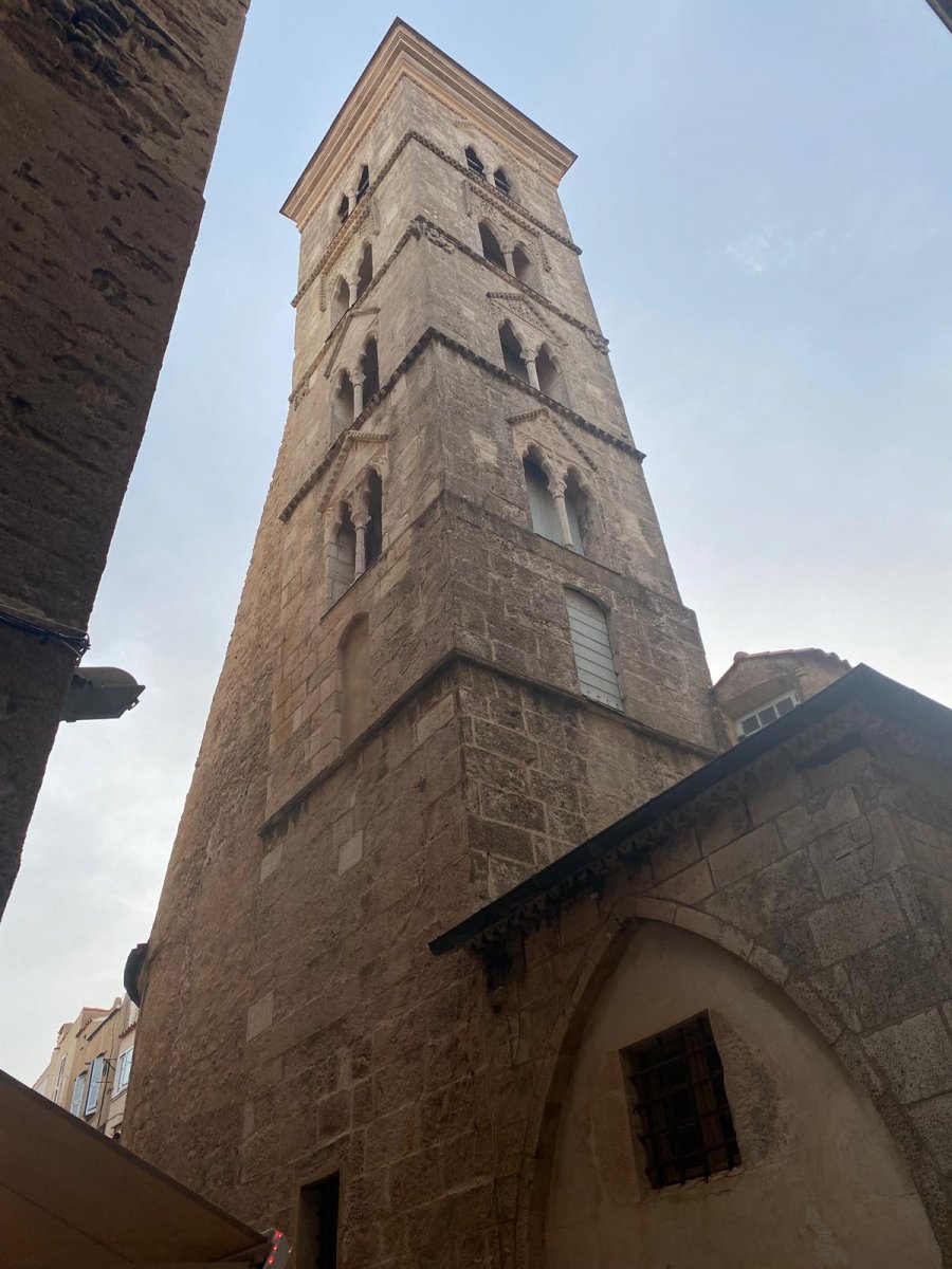 Sailing boat passing under the Tower Fanal bridge