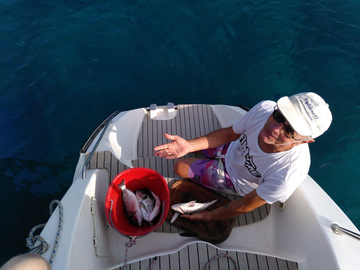 Night catamaran cruises through the Corinth canal from Poros