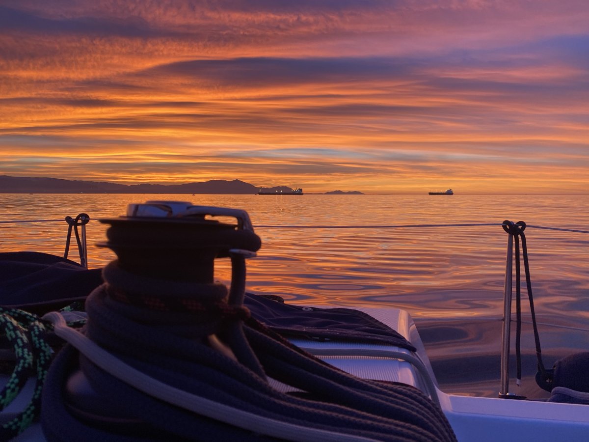 Sailboat in Bilbao harbor at sunset