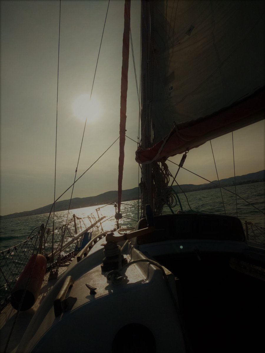 A sailboat docked in Peñíscola harbor