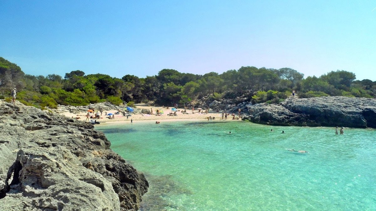 Walking on the Beach in a Sailboat in Menorca
