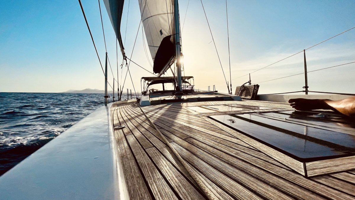Daytime sailing course at sea with coastal views