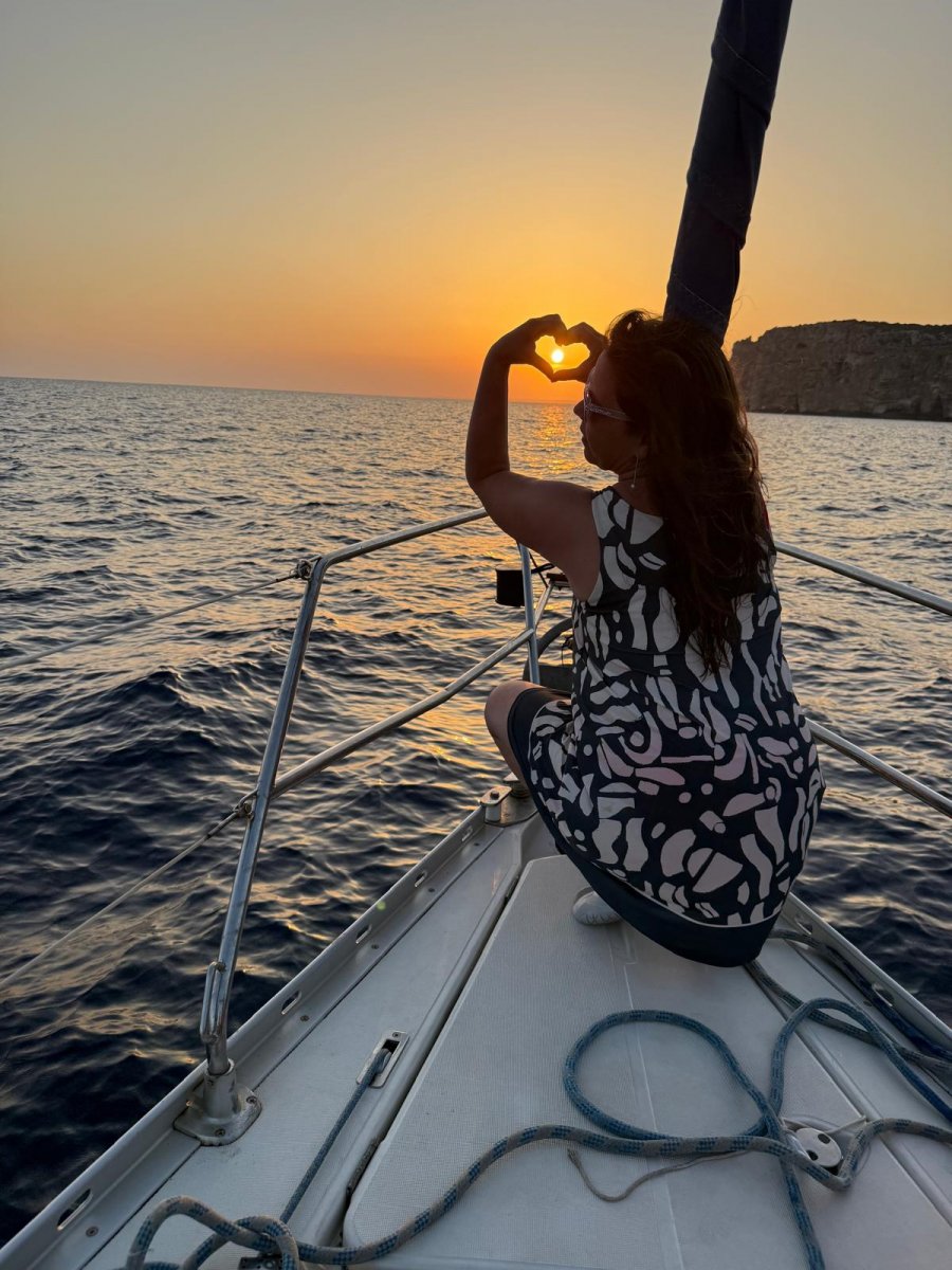 Enjoy a dinner on board while watching the sunset of Barcelona