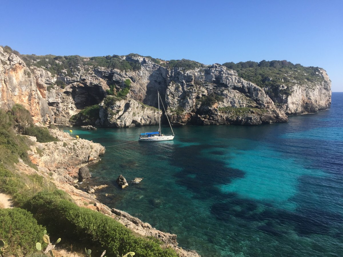 Explore Menorca's coastlines while sailing