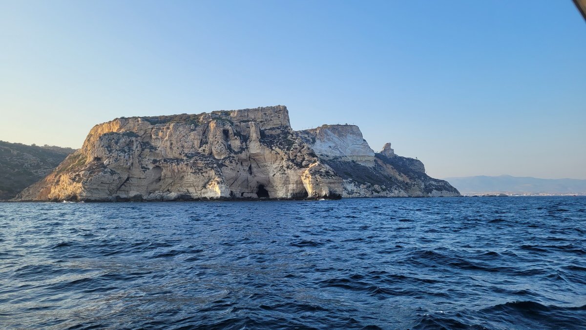 Unwind and enjoy the scenery during a cruise in the Gulf of Cagliari