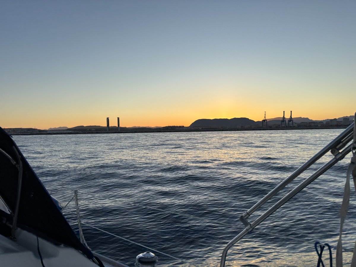 Couple sailing at sunset in private sailboat in Alicante